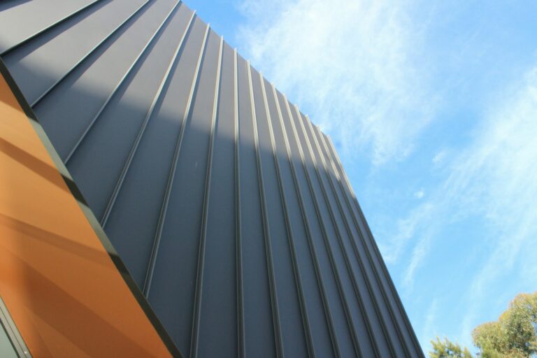 a close up of a building with a blue sky in the background